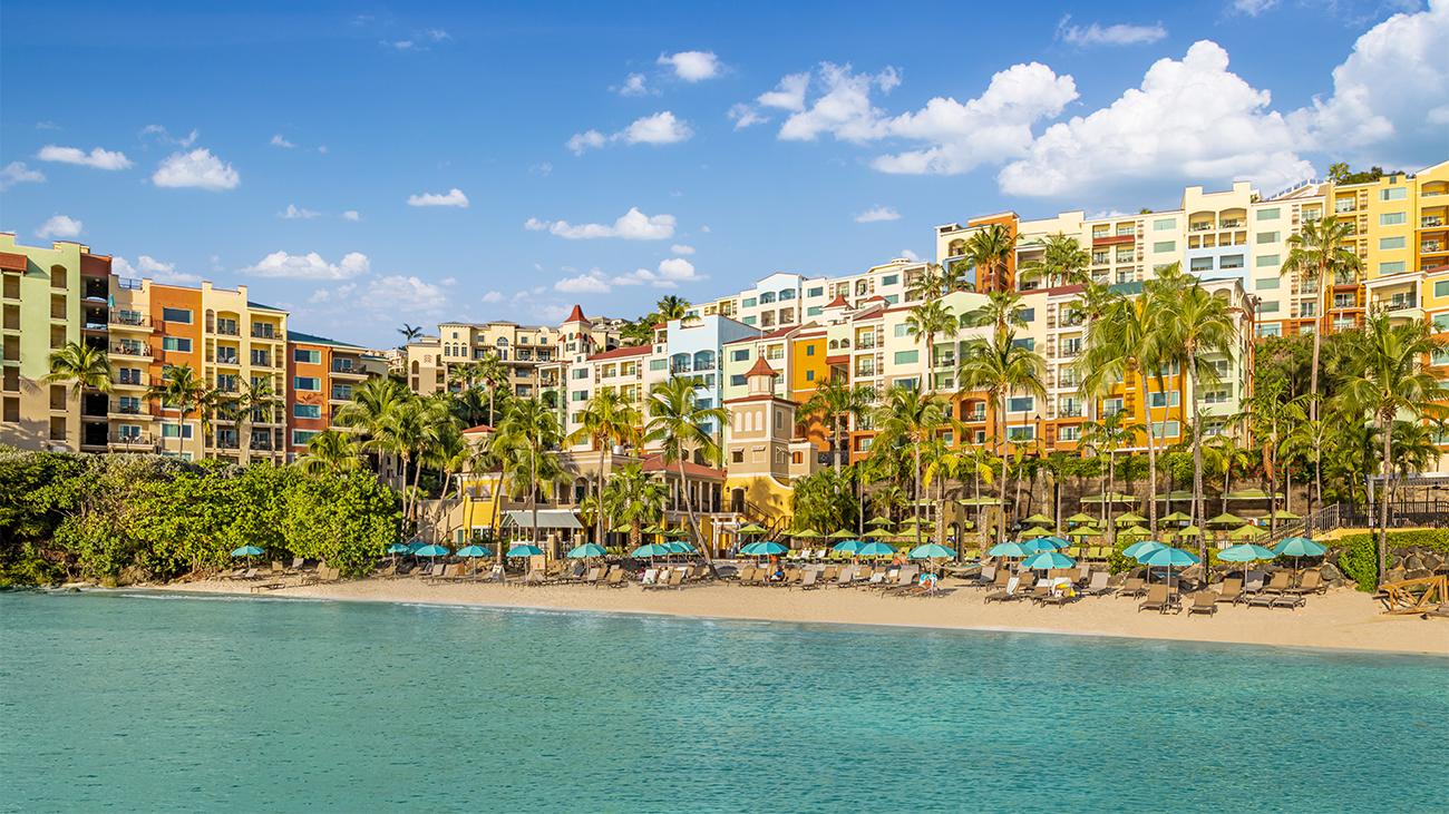 Exterior of Marriott's Frenchman’s Cove resort timeshare from the beach along Pacquereau Bay